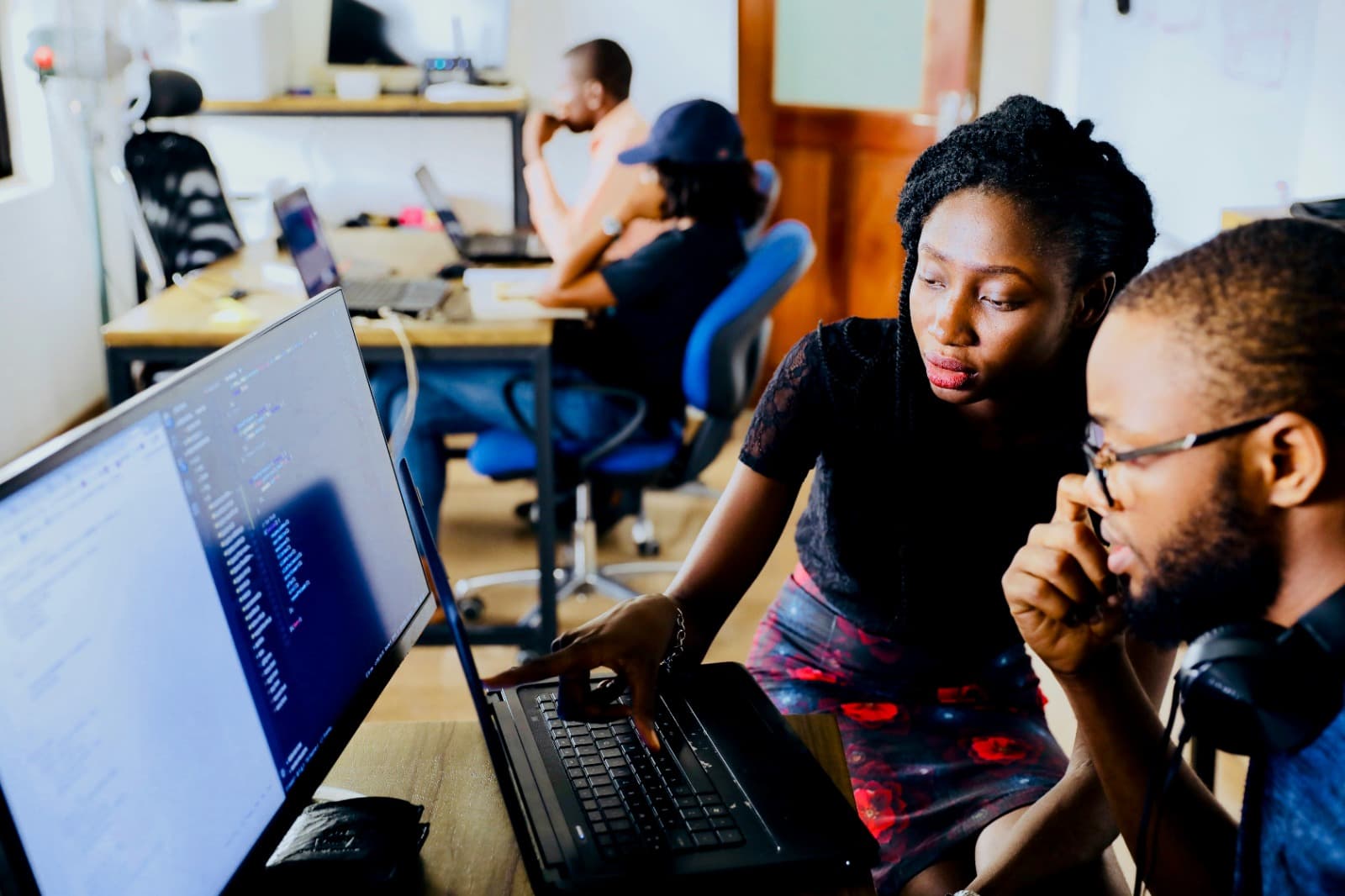 Team collaborating on a complex build at a workstation